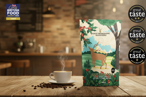 Coffee package with a deer design on a wooden table with a blurred kitchen background