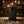 Black tumbler with a white deer logo on a wooden surface