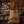 A natural burlap tote bag with black printed text reading 'CAFÉ DE GUATEMALA 2022|2023' hanging on a white paneled wall next to a wooden door frame.