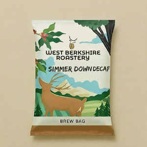 A single coffee brew bag package from West Berkshire Roastery, labeled Simmer Down Decaf, featuring an illustrated deer, trees, mountains, and a small bee on a warm beige background.