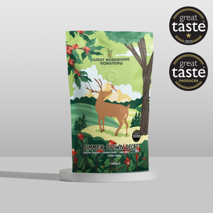 Coffee bag with deer illustration and 'Great Taste' awards on a white background